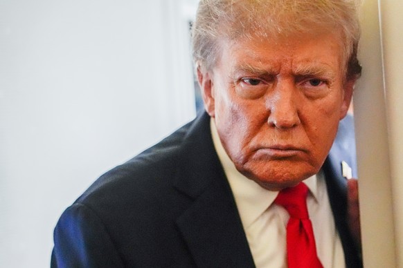 President Donald Trump speaks to reporters aboard Air Force One while en route to meet with Russia&#039;s President Vladimir Putin at Joint Base Elmendorf-Richardson, Alaska, Friday, Aug. 15, 2025. (A ...