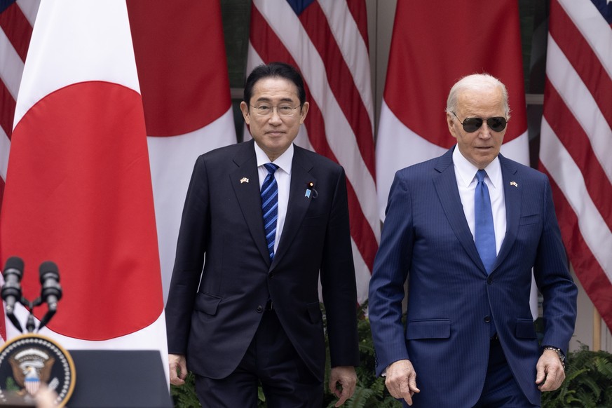 epa11270965 US President Joe Biden (R) and Prime Minister of Japan Fumio Kishida (L) walk out to hold a joint news conference in the Rose Garden of the White House, in Washington, DC, USA, 10 April 20 ...