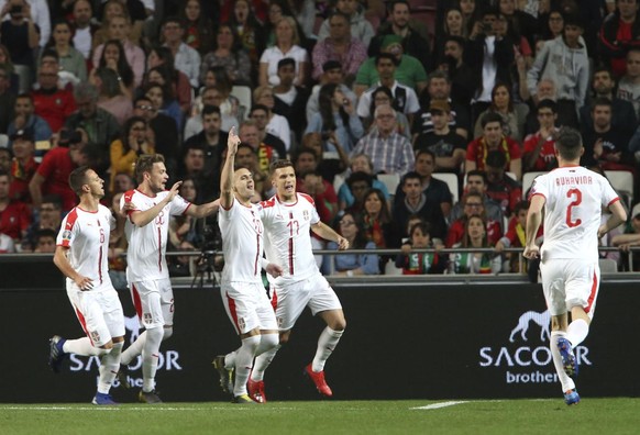 Serbia&#039;s players celebrate after Serbia&#039;s Dusan Tadic scored his side&#039;s opening goal during the Euro 2020 group B qualifying soccer match between Portugal and Serbia at the Luz stadium  ...