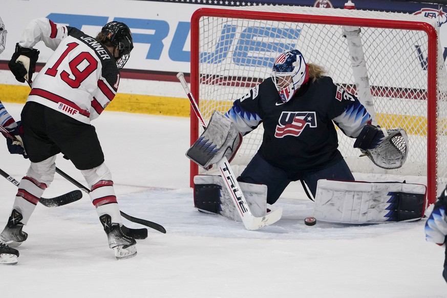 FILE - United States goalie Alex Cavallini, right, stops a shot from Canada&#039;s Brianne Jenner (19) during the second period of a women&#039;s exhibition hockey game ahead of the Beijing Olympics W ...