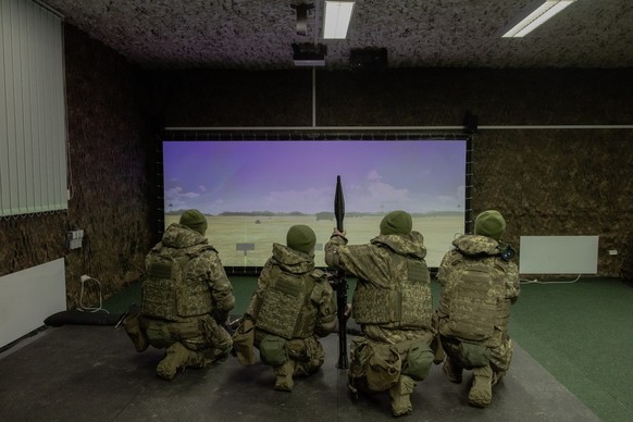 Ukrainian recruits complete basic military training at the Ukrainian Ground Forces training center in an undisclosed location on March 25, 2026, amid the Russian invasion of Ukraine. (Photo by Roman P ...