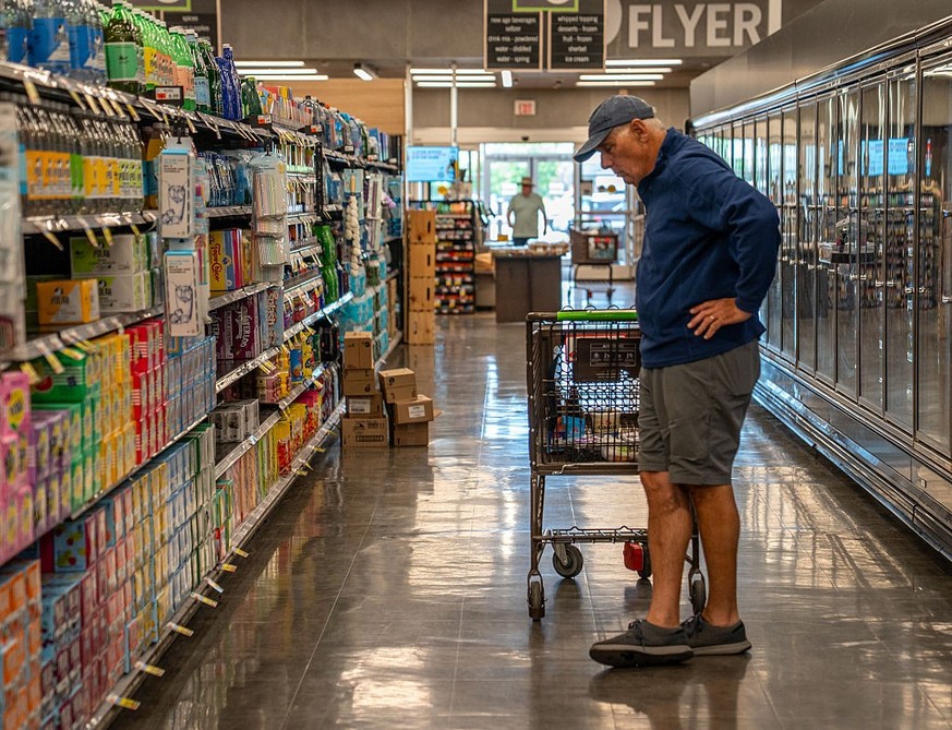 SOUTH BURLINGTON, VERMONT - JUNE 4: A shopper looks at a beverage display June 4, 2026 at the Market 32 Supermarket in South Burlington, Vermont. Food prices have increased nearly 30% since 2020 accor ...