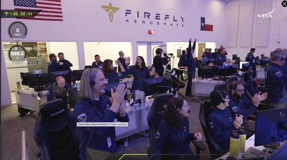 Staff at the Mission Control outside Austin, Texas celebrating as lunar lander Blue Ghost touches down on the moon with a special delivery for NASA, Sunday, March 2, 2025. (NASA/Firefly Aerospace via  ...