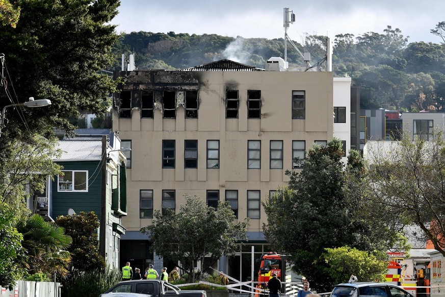 epaselect epa10630526 Emergency personnel work at the scene of a fire at the Loafers Lodge hostel, in Wellington, New Zealand, 16 May 2023. Multiple people are believed to be dead after a fire ripped  ...