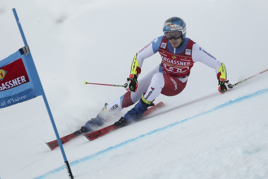 Switzerland&#039;s Marco Odermatt speeds down the course during the first run of an alpine ski, men&#039;s World Cup giant slalom, in Val D&#039;Isere, France, Saturday, Dec. 11, 2021. (AP Photo/Gabri ...