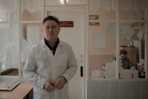 Doctor Oles Telyukov poses for a photograph in the women&#039;s ward of the Poltava Regional Psychiatric Hospital, in Poltava, on March 19, 2025, amid the Russian invasion of Ukraine. (Photo by Ivan S ...
