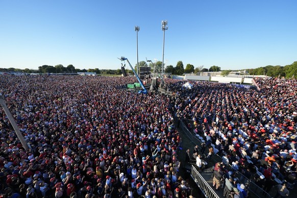 Attendees listen as Republican presidential nominee former President Donald Trump speaks at a campaign event at the Butler Farm Show, Saturday, Oct. 5, 2024, in Butler, Pa. (AP Photo/Alex Brandon).Don ...