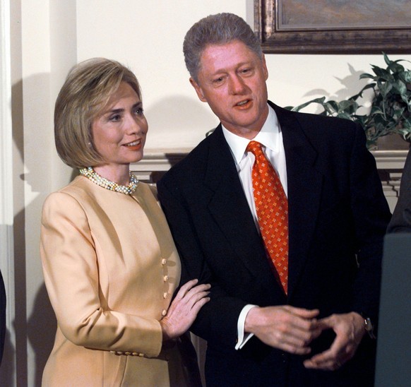 First lady Hillary Rodham Clinton stands with President Clinton during a White House event on after-school child care Monday, Jan. 26, 1998, in Washington. President Clinton angrily denied any imprope ...