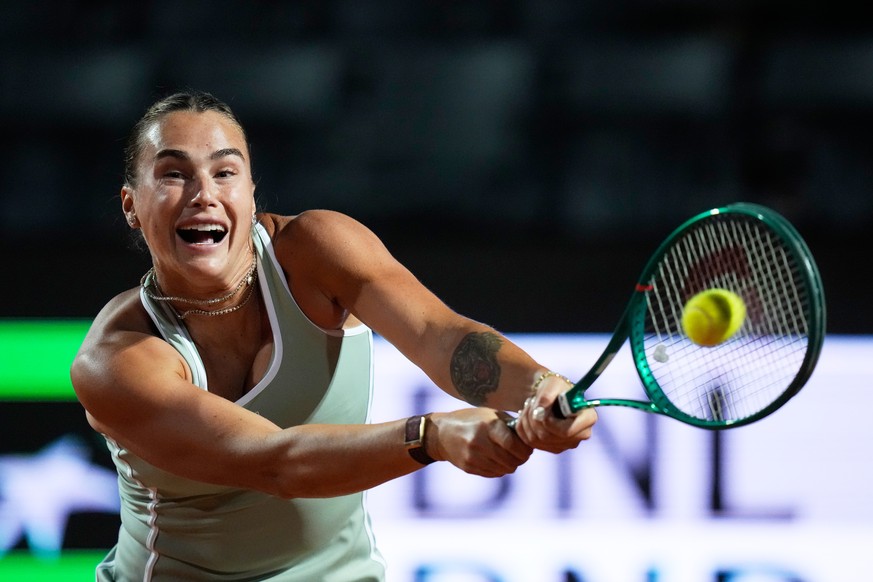 Aryna Sabalenka, of Belarus, returns the ball to Barbora Krejcikova, of Czechia, during their match at the Italian Open tennis tournament in Rome, Thursday, May 7, 2026. (AP Photo/Alessandra Tarantino ...