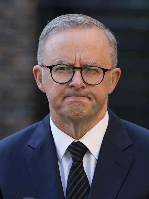 Australian Prime Minister Anthony Albanese grimaces as he answers a question about quests invited to the funeral Queen Elizabeth II in Sydney, Australia, Wednesday, Sept. 14, 2022. Albanese announced  ...