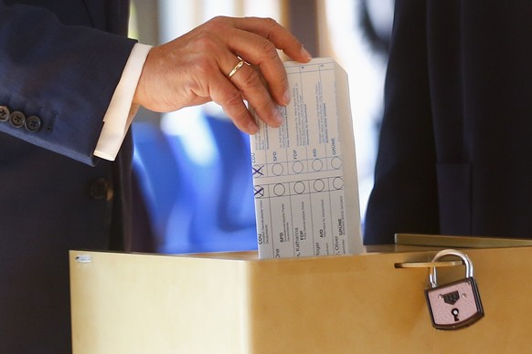 Armin Laschet, Christian Union parties candidate for Chancellery and Minister President of North Rhine-Westphalia, casts his ballot for the German parliament election in Aachen, Germany, Sunday, Sept. ...