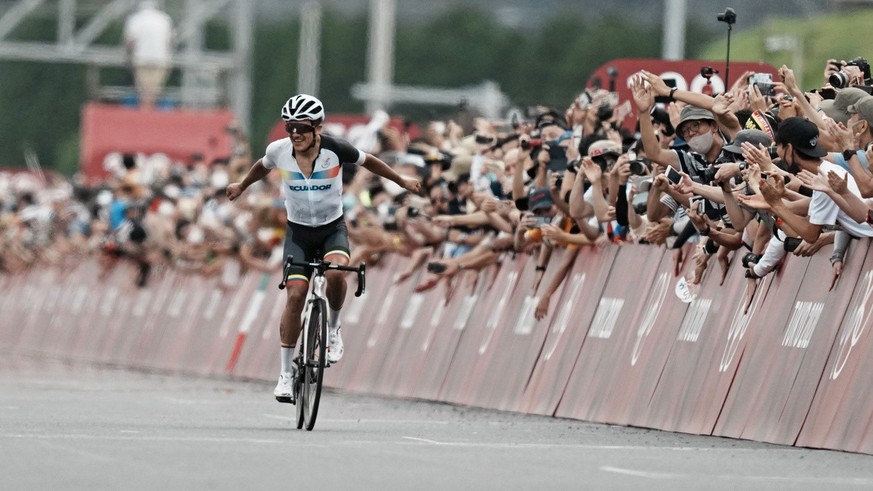 Richard Carapaz of Ecuador celebrates after winning the gold medal during the men&#039;s cycling road race at the 2020 Summer Olympics, Saturday, July 24, 2021, in Oyama, Japan. (AP Photo/Thibault Cam ...