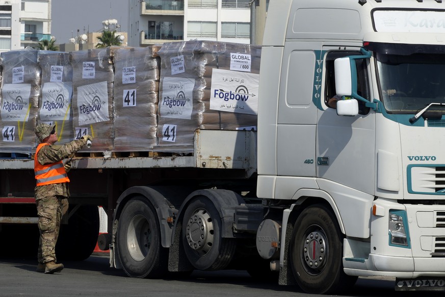 A U.S soldier inspects Gaza aid on a truck before entering a U.S ship at the port of Larnaca, Cyprus, Wednesday, June 26, 2024. An official with the U.S. humanitarian assistance agency USAID says thou ...