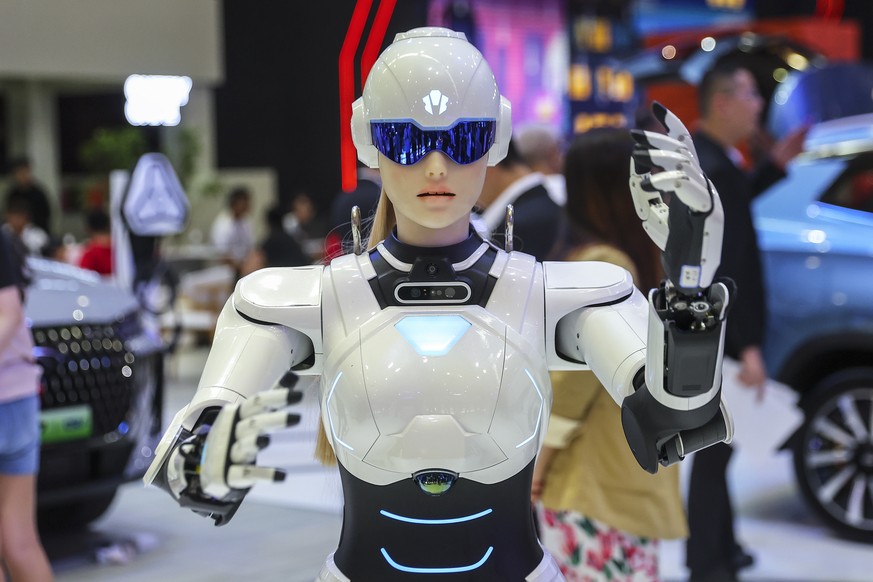 epa12091101 'Mornine,' a Chery Automobile humanoid robot sales assistant, dances during the Malaysia Autoshow 2025 in Kuala Lumpur, Malaysia, 10 May 2025 (issued 11 May 2025). The Chery AiMO ...
