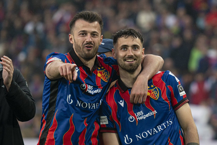 Basel, Switzerland, May 4th 2025 Dominik Schmid 31 FC Basel, right, and Albian Ajeti 23 FC Basel, left, iafter the Credit Suisse Super League between FC Basel 1893 and Servette Football Club Geneve at ...