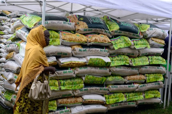 A woman walks past a stand loaded with Eko Rice as the Lagos State Ministry of Agriculture and Food Systems concludes activities for the 2024 World Food Day, tagged Eko World Food Day, with a fair and ...