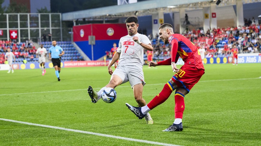 Switzerland&#039;s forward Zeki Amdouni, left, fights for the ball with Andorra&#039;s defender Albert Alavedra, right, during the UEFA Euro 2024 qualifying group I soccer match between Andorra and Sw ...