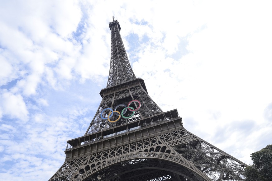 epa11617733 A view of the Eiffel Tower with the Olympic Rings in Paris, France, 21 September 2024. The elevator machinery area of the Eiffel Tower is usually closed to the public and is only open on s ...