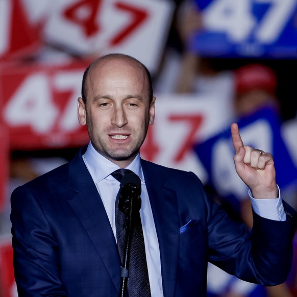 epa11689678 Former White House adviser Stephen Miller speaks before former US president and Republican presidential nominee Donald Trump speaks at a campaign event at McCamish Pavillion on the campus  ...
