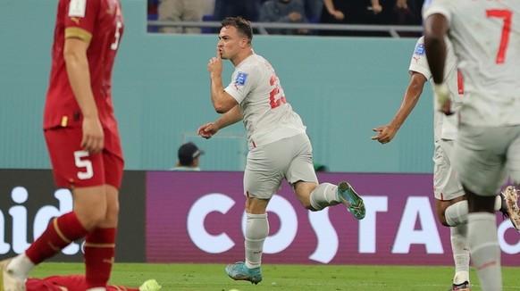 epa10345032 Xherdan Shaqiri (C) of Switzerland celebrates scoring the opening goal during the FIFA World Cup 2022 group G soccer match between Serbia and Switzerland at Stadium 947 in Doha, Qatar, 02  ...