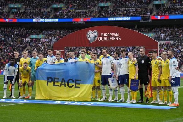 Players pose for photo before the Euro 2024 group C qualifying soccer match between England and Ukraine at Wembley Stadium in London, Sunday, March 26, 2023. (AP Photo/Alastair Grant)