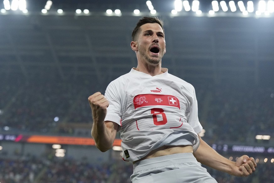 Switzerland&#039;s Remo Freuler celebrates after scoring his side&#039;s third goal during the World Cup group G soccer match between Serbia and Switzerland, in Doha, Qatar, Friday Dec. 2, 2022. (AP P ...