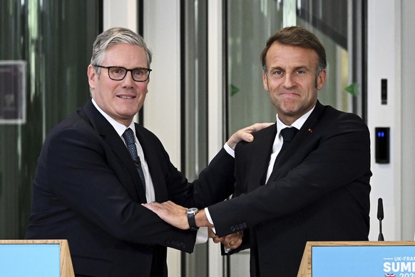British Prime Minister Keir Starmer, left, and French President Emmanuel Macron hold a joint press conference in London, Thursday July 10, 2025. (Leon Neal/Pool Photo via AP)
Britain France