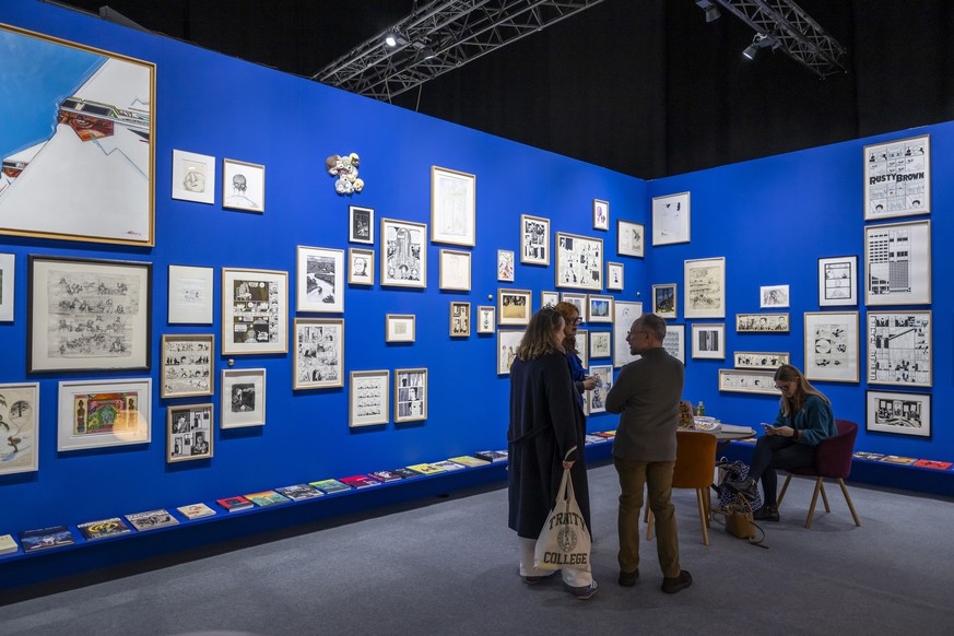 epa12687871 Visitors look at the work realized by Comics Museum Foundation, during the international art show artgeneve, in Geneva, Switzerland, 28 January 2026. The artgeneve exhibition is open to th ...