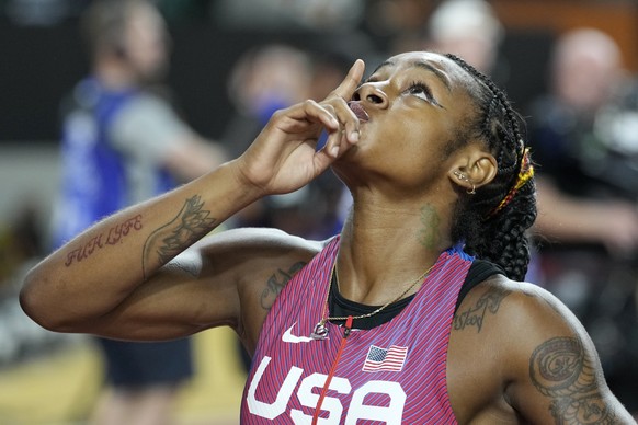 Sha&#039;Carri Richardson, of the United States, reacts after crossing the finish line to win the gold medal in the Women&#039;s 100-meter final during the World Athletics Championships in Budapest, H ...