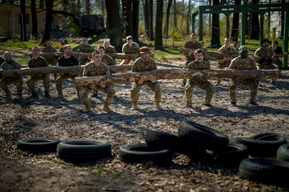 Recruits of the 3rd Assault Brigade train in the Kyiv region, Ukraine, Tuesday, April 9, 2024. (AP Photo/Vadim Ghirda)