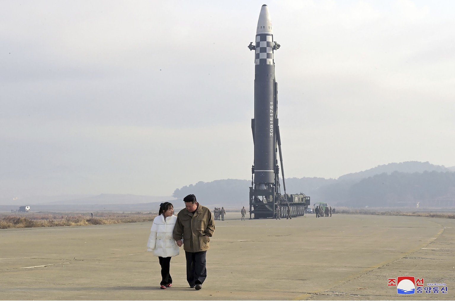 FILE - This photo provided on Nov. 19, 2022, by the North Korean government shows North Korean leader Kim Jong Un, right, and his daughter at the site of a missile launch at Pyongyang International Ai ...
