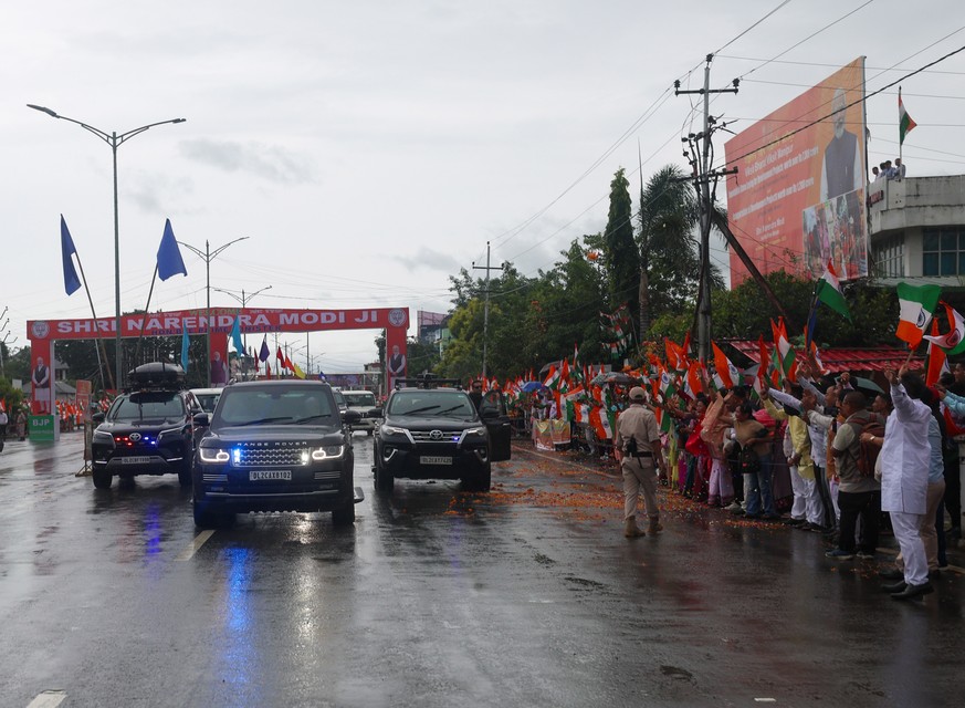 epa12373350 A handout photo made available by the press information bureau (PIB) shows Indian Prime Minister Narendra Modi during a road show in Imphal, Manipur, India, 13 September 2025. EPA/PRESS IN ...