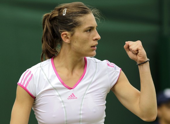 ARCHIV: Germany&#039;s Andrea Petkovic celebrates winning a point during her match against Russia&#039;s Ksenia Pervak at the All England Lawn Tennis Championships at Wimbledon (Foto vom 24.06.11). An ...