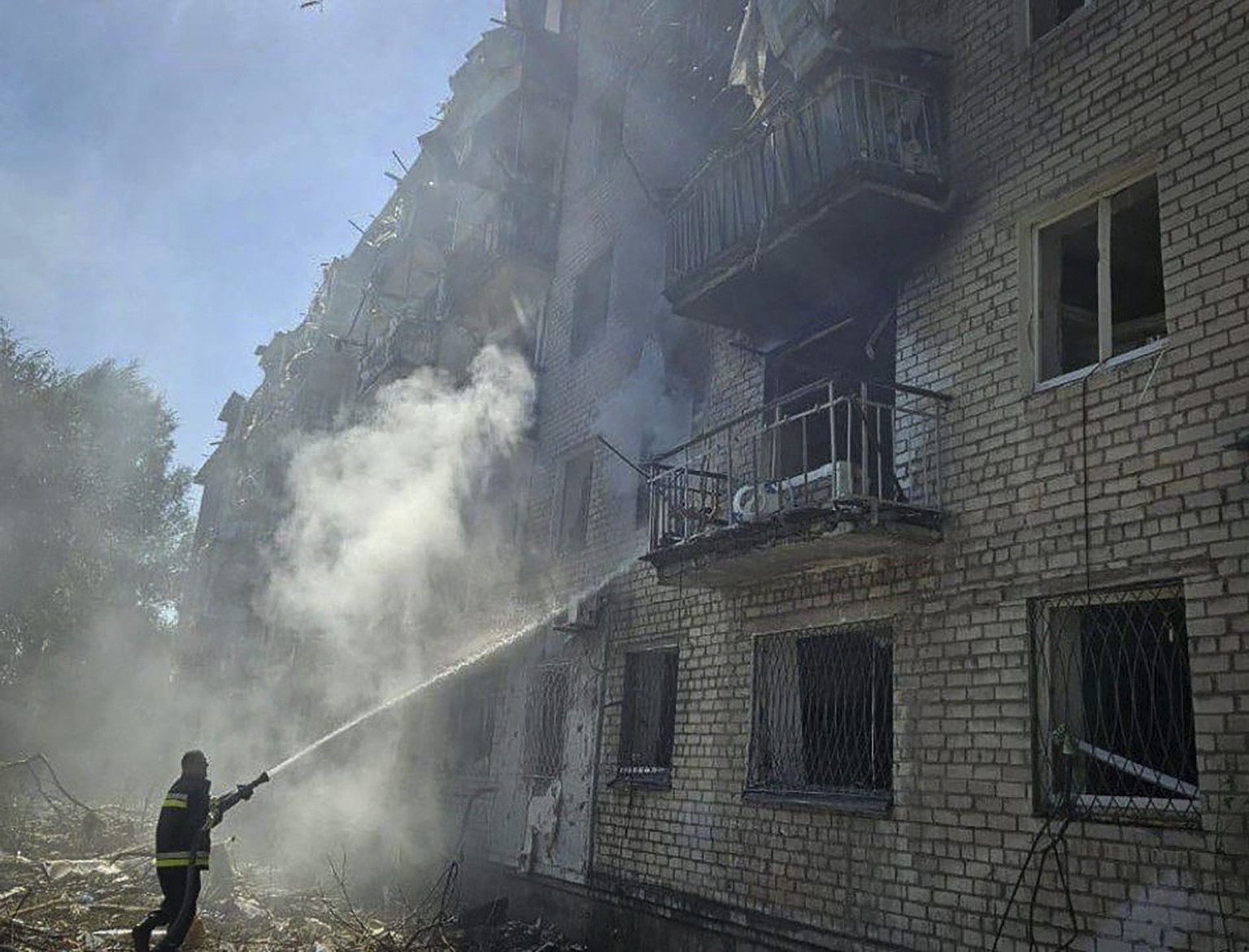 In this photo provided by the Ukrainian Emergency Service, firefighters put out a fire following a Russian missile attack in Pavlograd, Ukraine, Friday, Sept. 6, 2024. (Ukrainian Emergency Service via ...