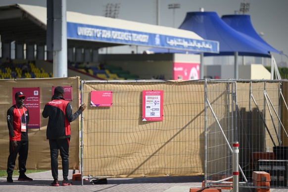 Security guards close a security gates during a totally closed training session of Swiss national soccer team in preparation for the FIFA World Cup Qatar 2022 at the University of Doha for Science and ...