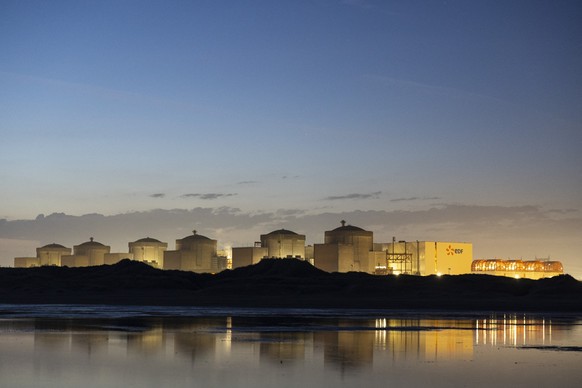 (FILES) This photograph shows the Gravelines nuclear power plant in Gravelines, northern France, on July 29, 2025. Four units at the Gravelines nuclear power plant (Nord) were shut down on August 11,  ...