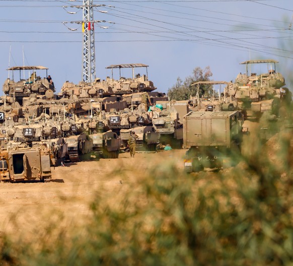 epa10928431 Israeli armored vehicles gathered at an undisclosed location near the border with Gaza, in Israel, 20 October 2023. More than 3,700 Palestinians and 1,400 Israelis have been killed accordi ...