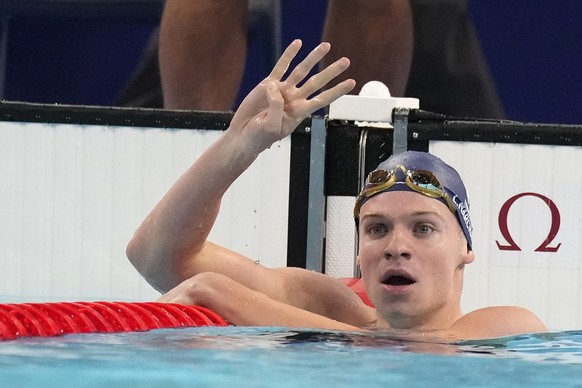 Leon Marchand of France, celebrates after winning the men&#039;s 200-meter individual medley final at the 2024 Summer Olympics, Friday, Aug. 2, 2024, in Nanterre, France. (AP Photo/Natacha Pisarenko)