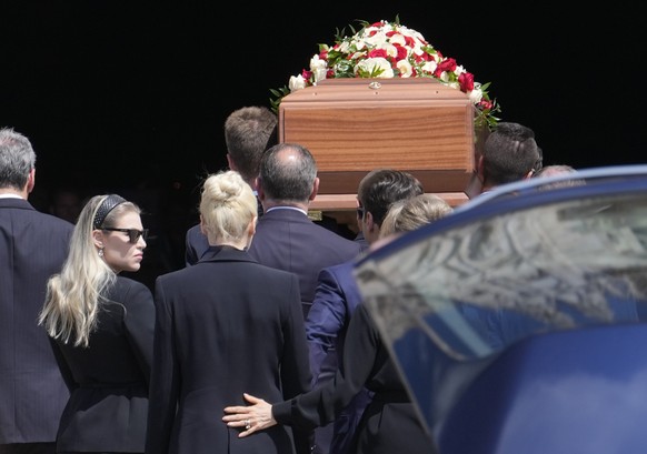 The coffin containing the body of media mogul and former Italian Premier Silvio Berlusconi is followed by, from left, her daughter Barbara, partner Marta Fascina, son Pier Silvio, and daughter Marina  ...