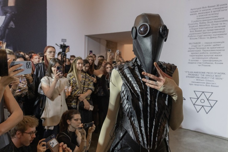 A model presents a creation of Bob Basset brand's collection during the Ukrainian Fashion Week in The Mystetskyi Arsenal National Art and Culture Museum Complex in Kyiv on September 4, 2026, amid ...