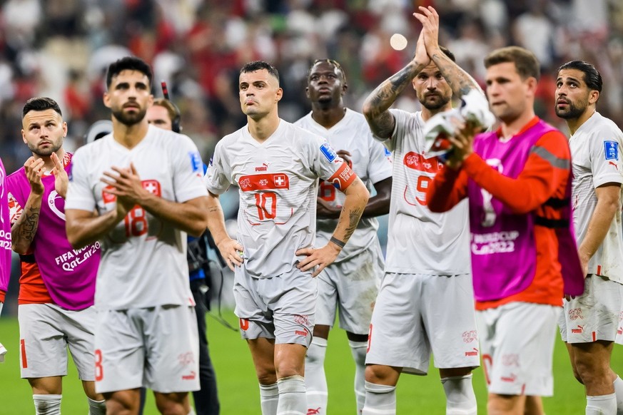 epa10353002 Players of Switzerland leave the pitch after the FIFA World Cup 2022 round of 16 soccer match between Portugal and Switzerland at Lusail Stadium in Lusail, Qatar, 06 December 2022. Portuga ...