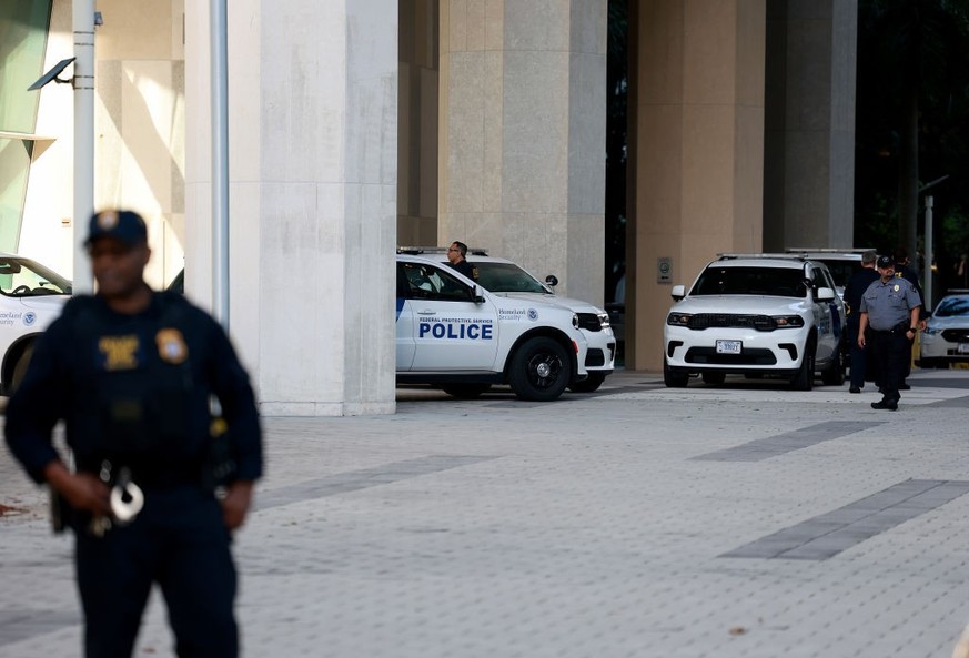 MIAMI, FLORIDA - JUNE 13: Department of Homeland Security police officers stand near an entrance to the Wilkie D. Ferguson Jr. United States Federal Courthouse before the arraignment of former Preside ...