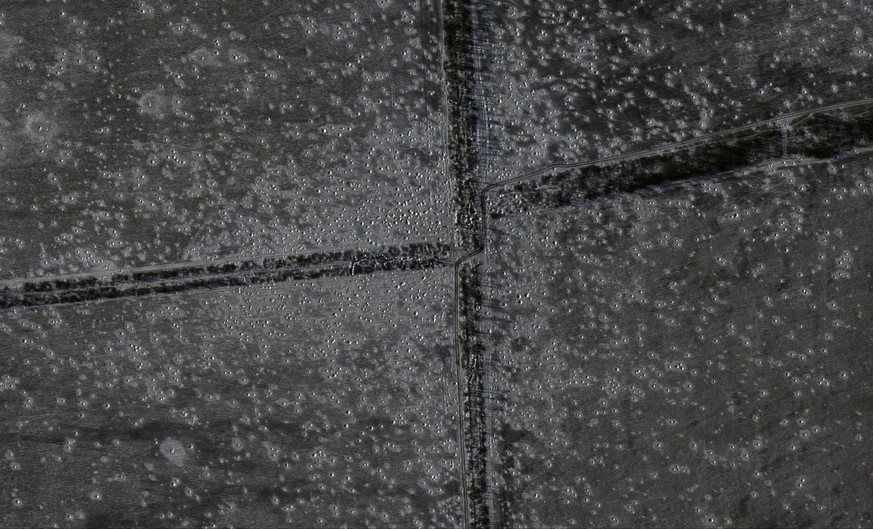 This undated satellite image provided by Maxar Technologies on Wednesday, Jan. 11, 2023, shows craters in fields in East Bakhmut, Ukraine. (Maxar Technologies via AP)