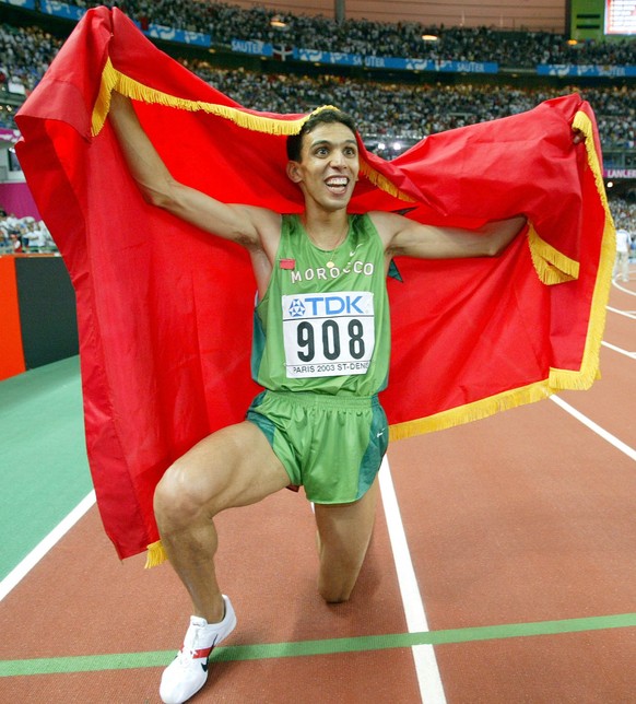 Morocco's Hicham El Guerrouj reacts after clinching the gold medal in the Men's 1500 meters at the World Athletics Championships at the Stade de France in Saint Denis, north of Paris Wednesd ...