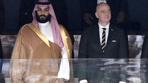 FILE - Saudi Arabia Crown Prince Mohammed bin Salman, left, and FIFA President Gianni Infantino, stand for the anthem prior to the match between Russia and Saudi Arabia which opened the 2018 soccer Wo ...