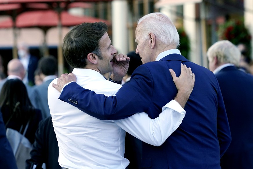 French President Emmanuel Macron whispers to U.S. President Joe Biden following their dinner at the G7 Summit in Elmau, Germany, Sunday, June 26, 2022. (AP Photo/Susan Walsh)
Emmanuel Macron,Joe Biden