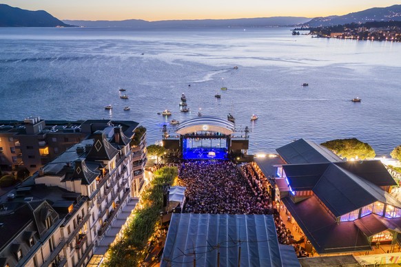 epa12243874 A aerial view during the concert of Hermanos Gutierrez as he performs on the Lake stage at the 59th Montreux Jazz Festival (MJF), in Montreux, Switzerland, Thursday, July 17, 2025. EPA/CYR ...