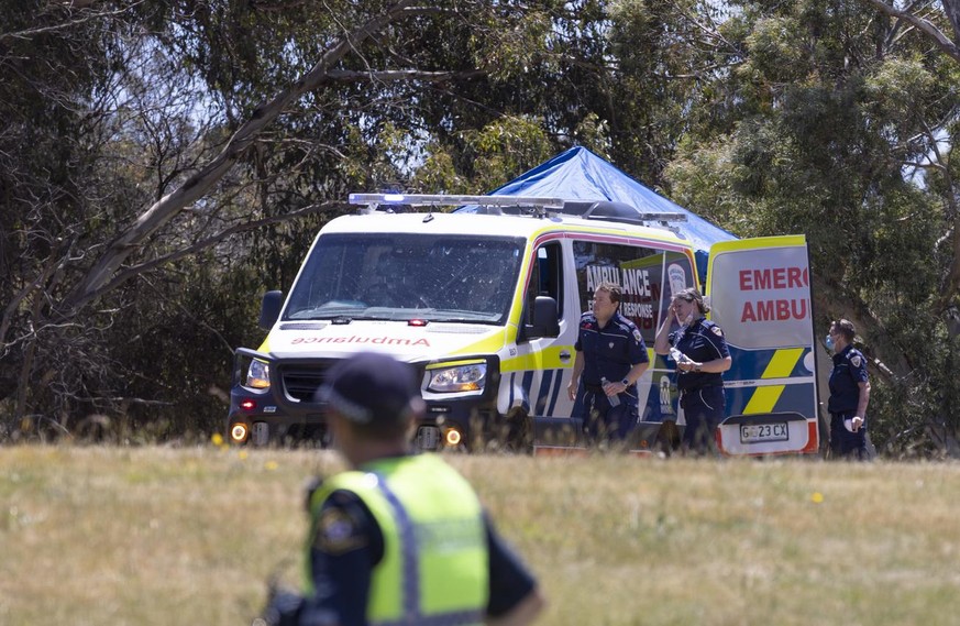 epa09644347 Ambulance personnel on scene at Hillcrest Primary School in Devonport, Tasmania, Australia, 16 December 2021. Several children have suffered serious injuries in northwest Tasmania after fa ...