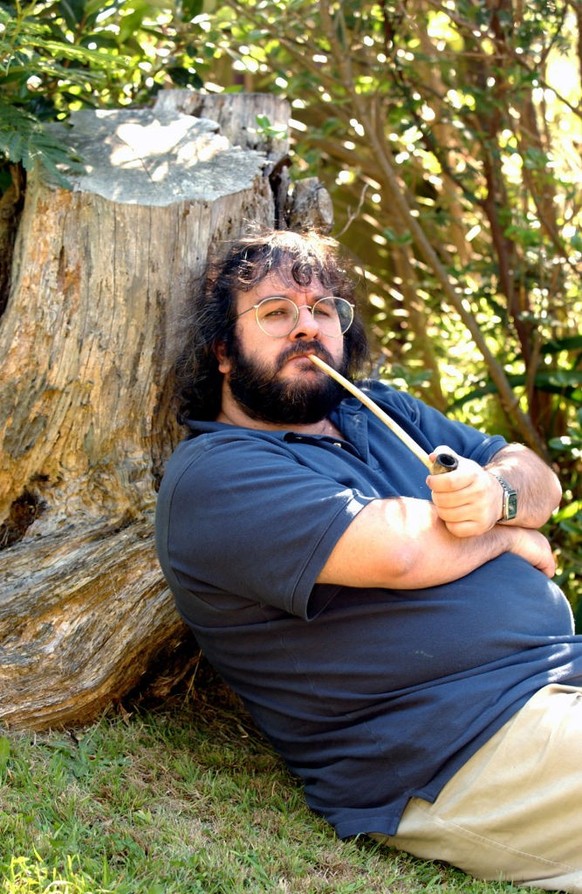 WELLINGTON, NEW ZEALAND - MARCH 15: Peter Jackson, New Zealand director of The Lord of the Rings trilogy poses in the grounds of his Wingnut Films office in Wellington New Zealand with one of the pipe ...