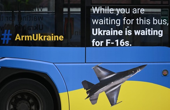 VILNIUS, LITHUANIA - JUNE 11, 2023: 
A media bus with inscriptions &#039;Arm Ukraine&#039; and &#039;While you are waiting for this bus, Ukraine is waiting for F-16s&#039; seen on day one of the 2023  ...